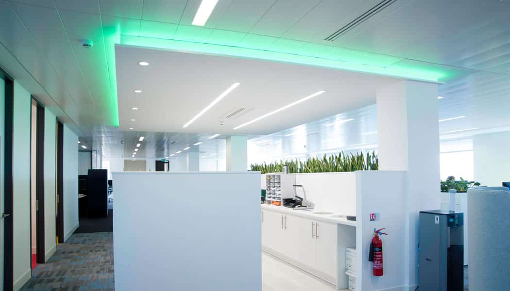 m-line emitting green light in white themed office