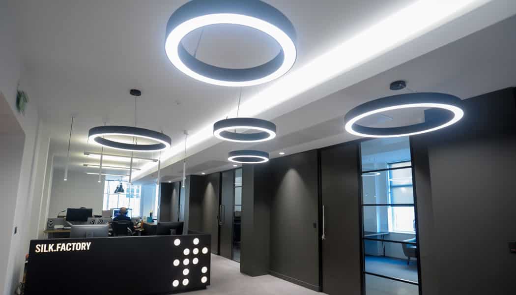 multiple circular shaped lights in black themed office