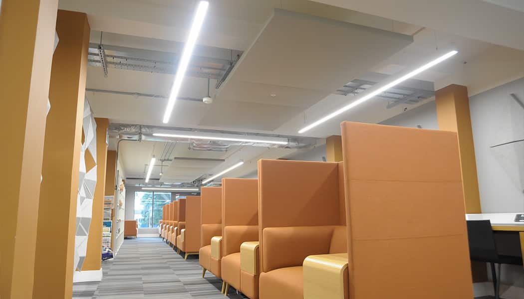 m-line in orange themed seating area and office