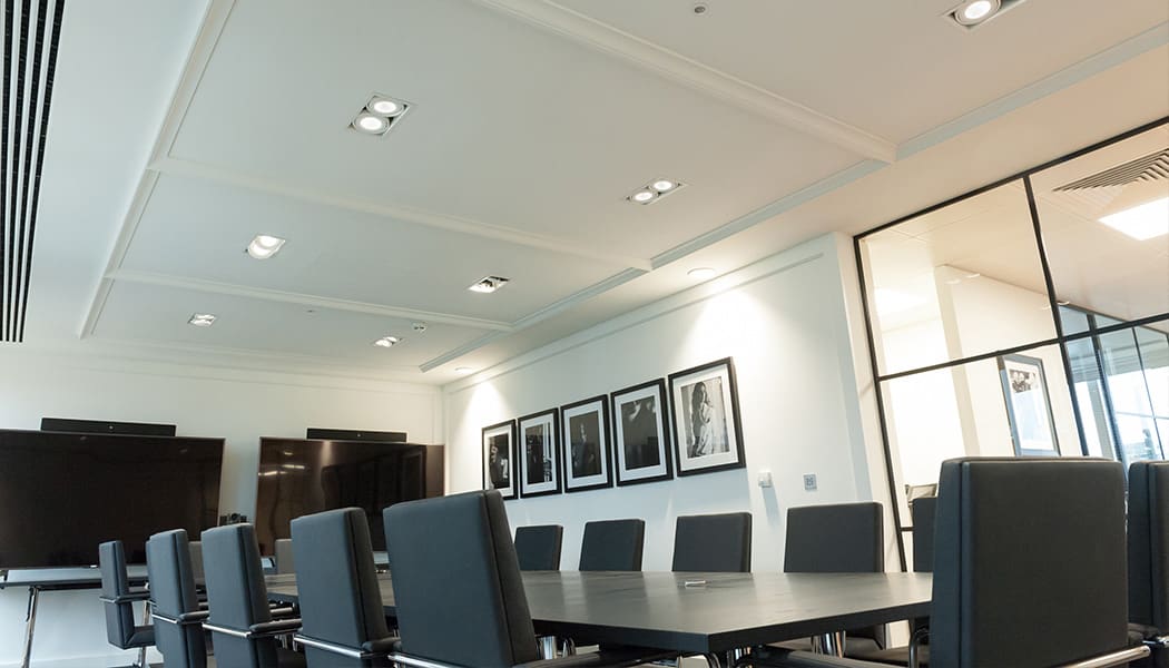 recessed lighting in black themed meeting room