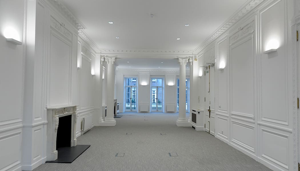 recessed lighting in white room and hallway