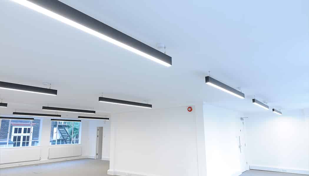 surface and suspended lighting in white empty room