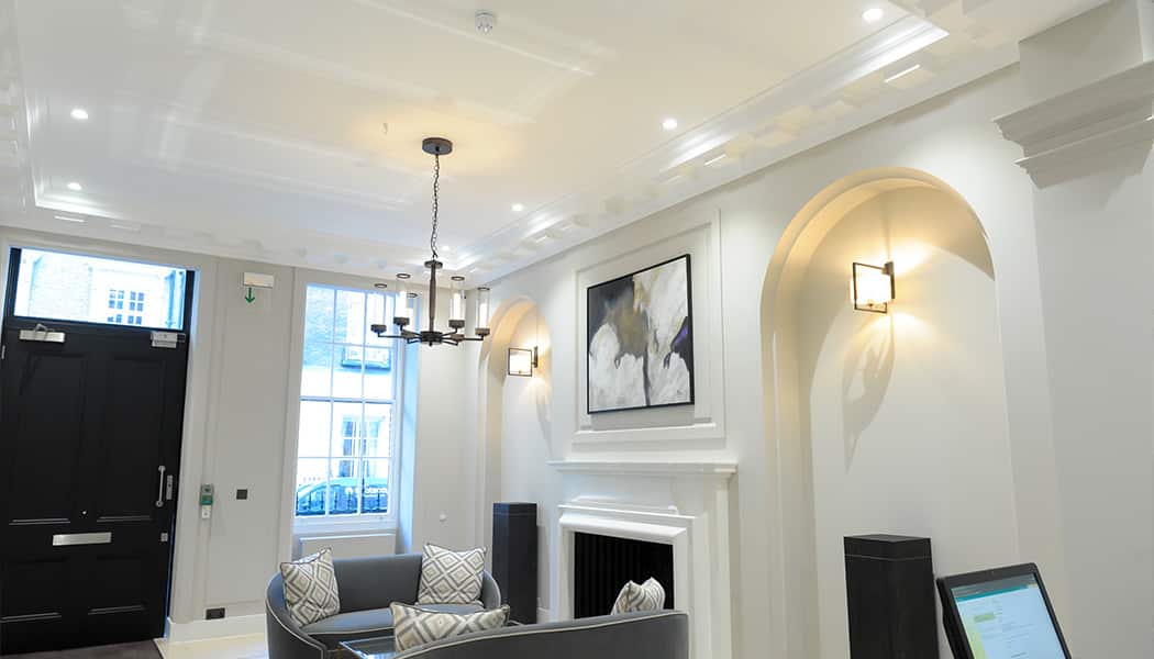 Recessed lighting in white reception area