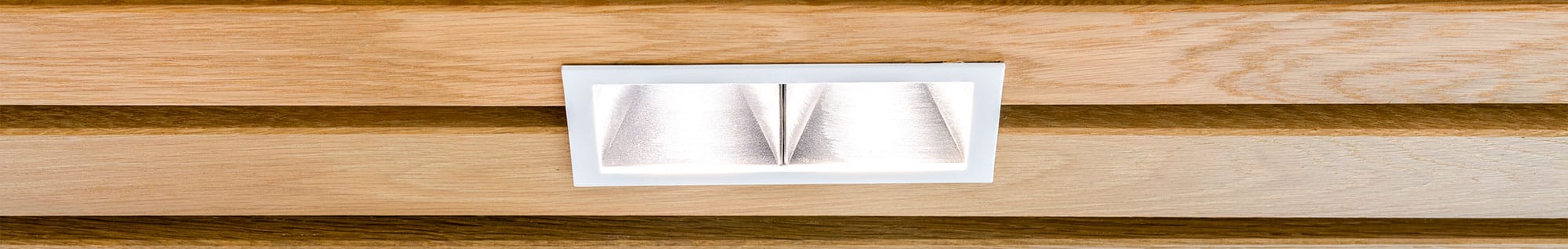 Quantum Recessed Downlight Featuring in the Slats of a Office