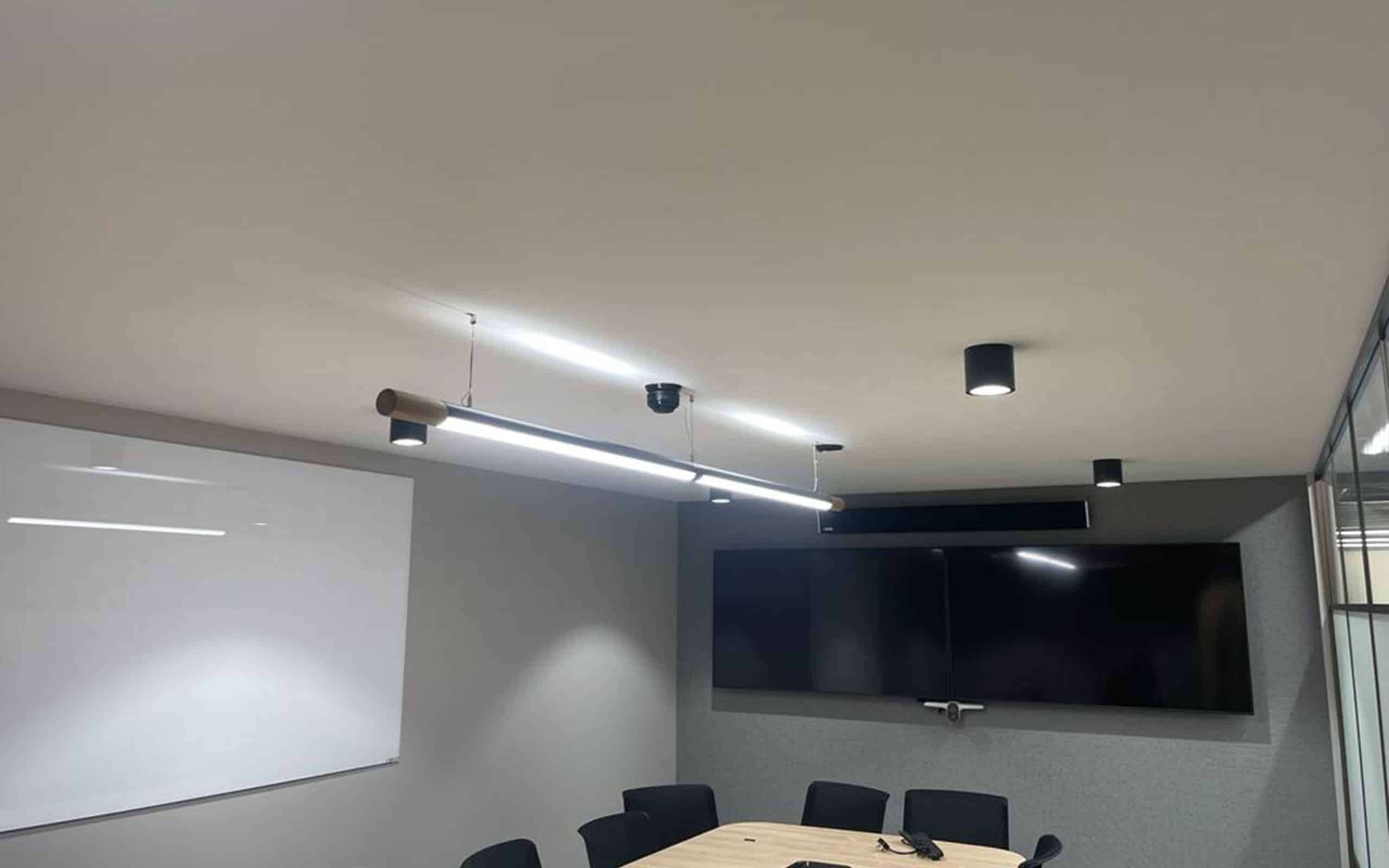 Surface mounted Force Down Lights Featured in Meeting Room of Luxury Office Space. Photo by Habit Action